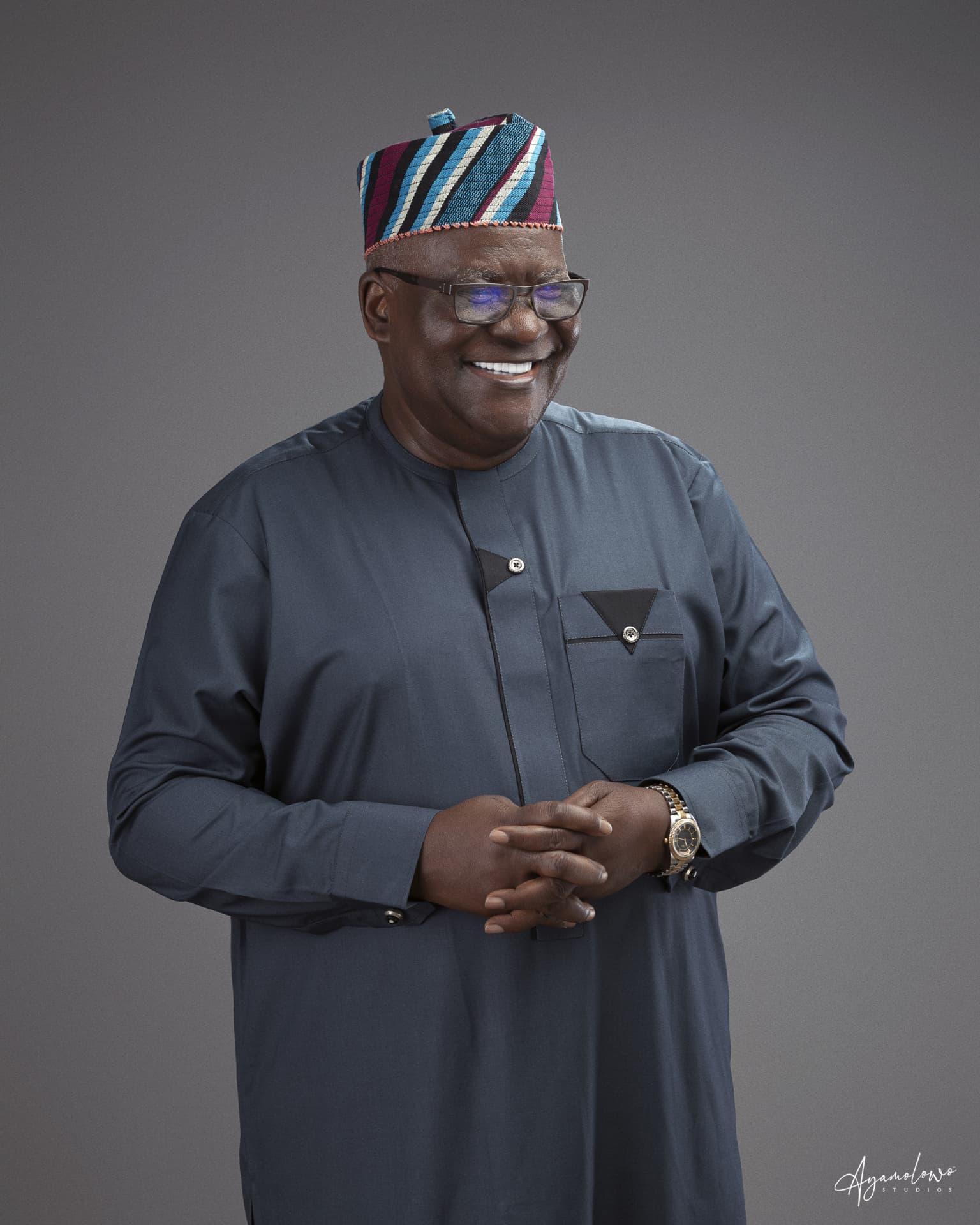 Studio portrait of Apostle Odeneye smiling