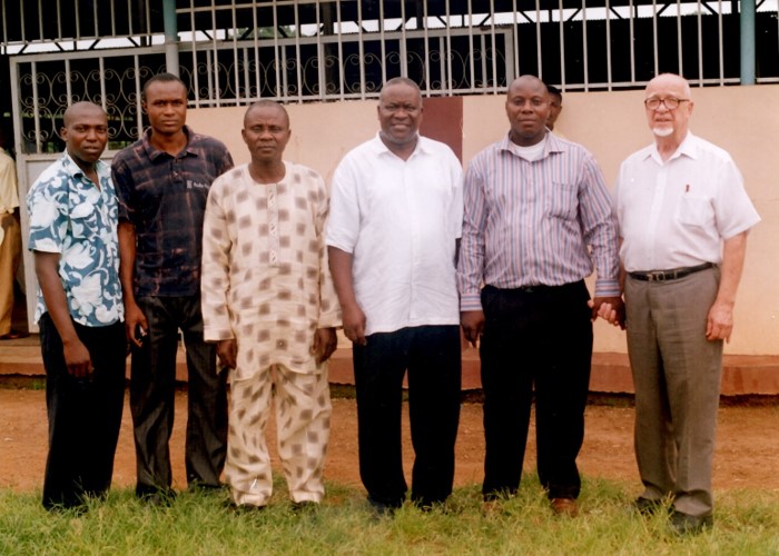 Apostle Odeneye standing with ministry partners